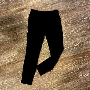 Black athletic leggings with zipper pocket in back waistband